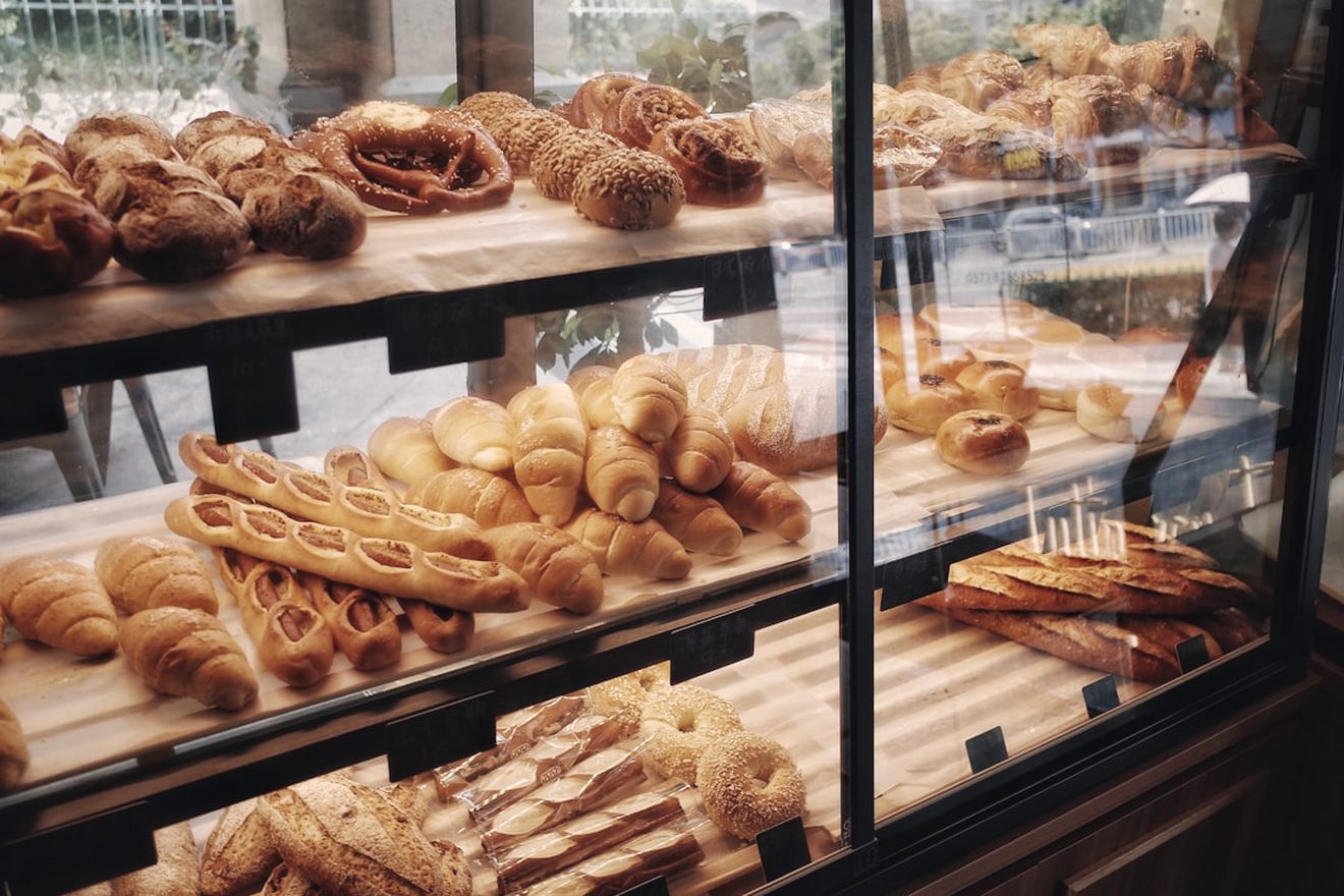 A bakery counter filled with fresh pastries