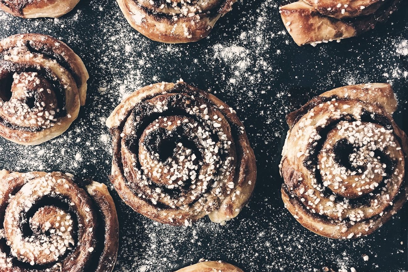 Freshly baked cinnamon rolls dusted with sugar